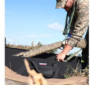 Hunter Picking Up A Shotgun From Easy-To-Access Lakewood Top-Opener Hardcase