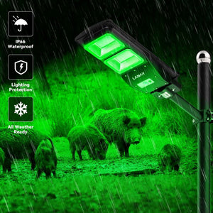 Solar feeder light emitting green light in a rain scene with hogs, highlighting waterproof and all-weather features.