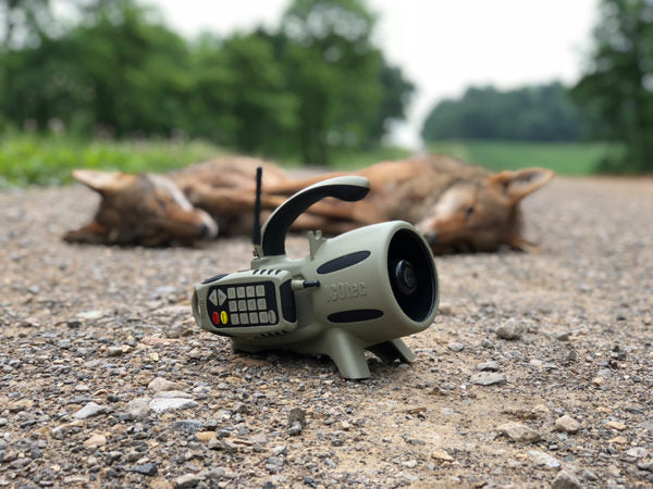 Load image into Gallery viewer, GC-300 Electronic Game Call With Remote For Hunting Predators And Dead Coyotes On Bckground
